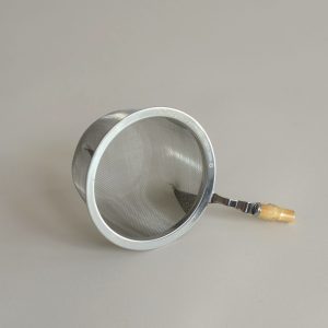 Photo of a stainless steel tea strainer with bamboo handle